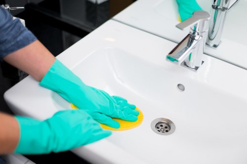 Cleaning a living room during end of tenancy cleaning in Harringay
