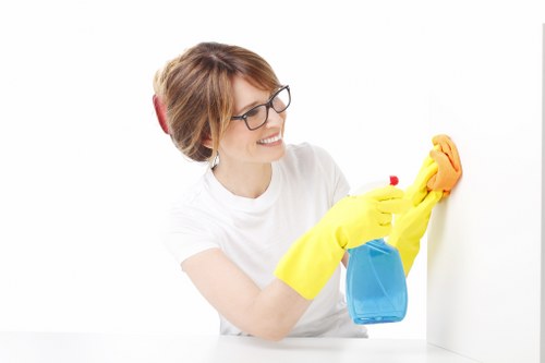 Local cleaner servicing a shopfront near Green Lanes in Harringay